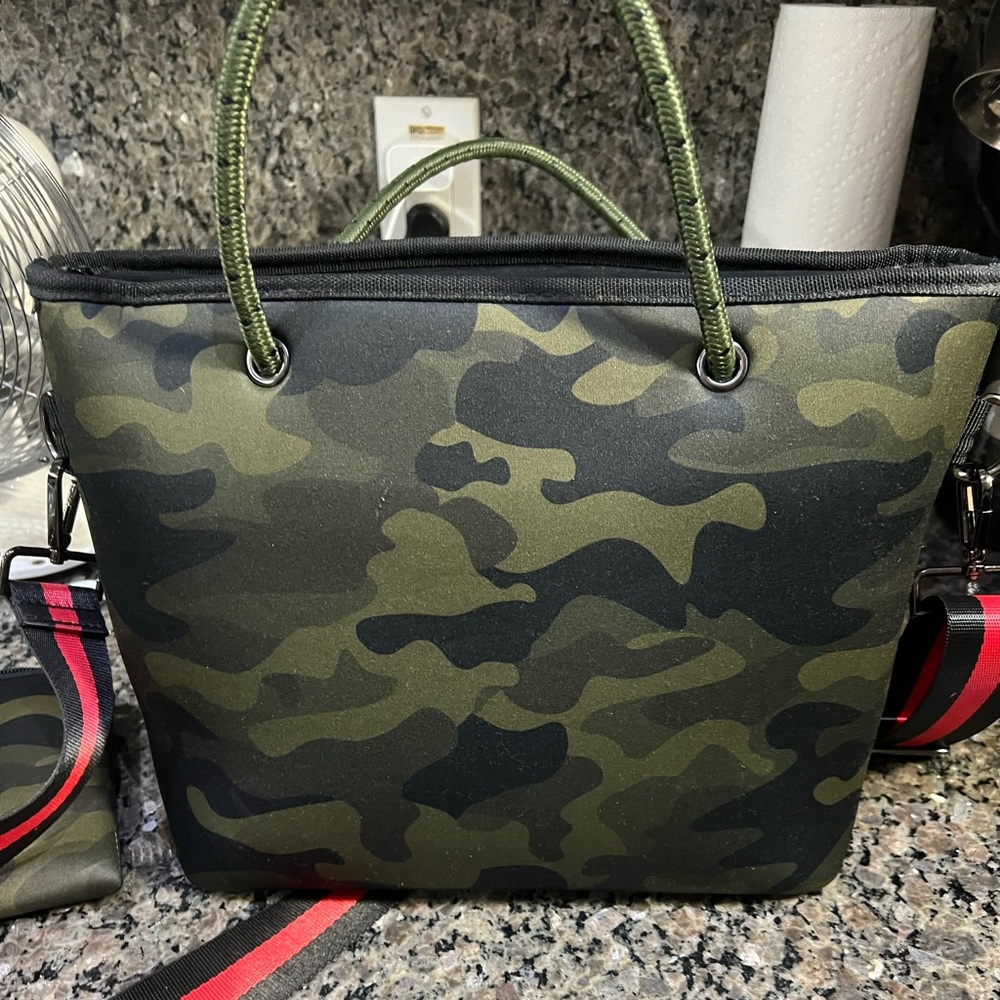 Haute Shore camo crossbody bag with small bag inside.